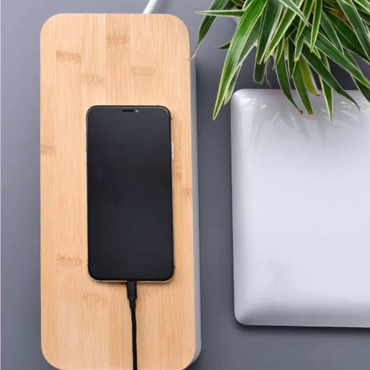 White and wooden cable box for a clean and organized workspace
